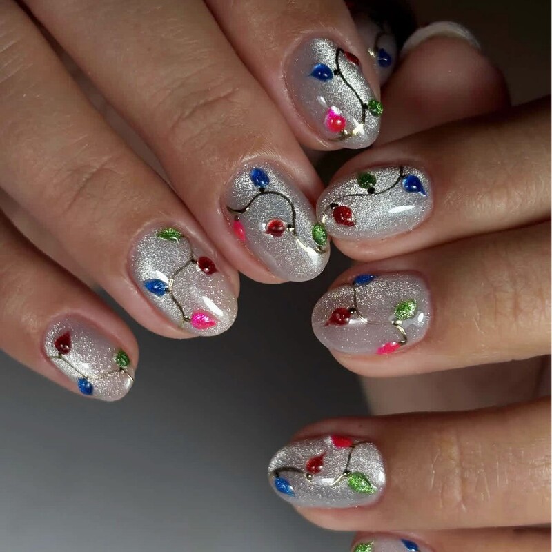 White base, playful short oval press-on nails, hand-painted colorful leaf nail pieces, cute and festive detachable style