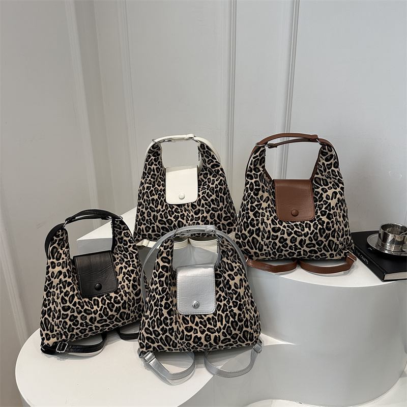 Mochila roja francesa retro para mujeres 2024 nueva moda extranjera bolsa de tres usos de gran capacidad mochila de cuero suave