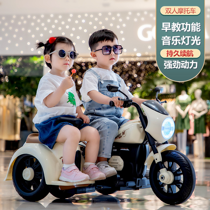 Nuevo triciclo eléctrico para niños para dos personas con mochila recargable y motocicleta de control remoto para niños