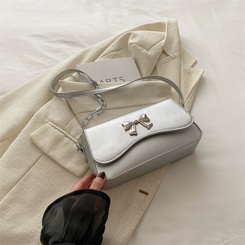 Este año popular bolso de arco para mujeres 2024 nuevo estilo extranjero primavera y verano mini bolso de cadena bolso de mochila