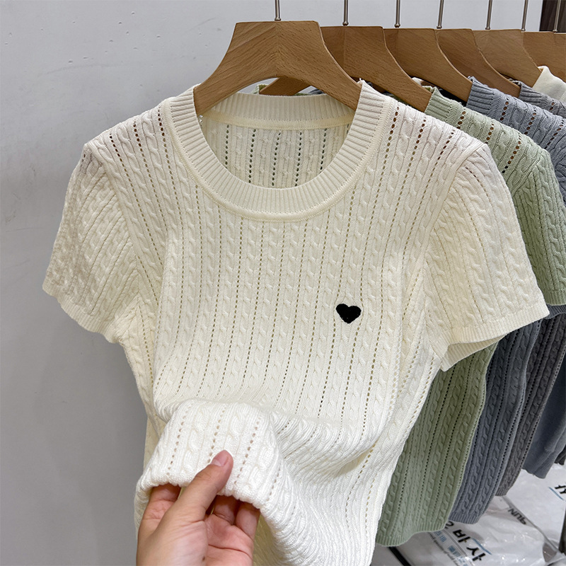 Knitted sweater with a round collar