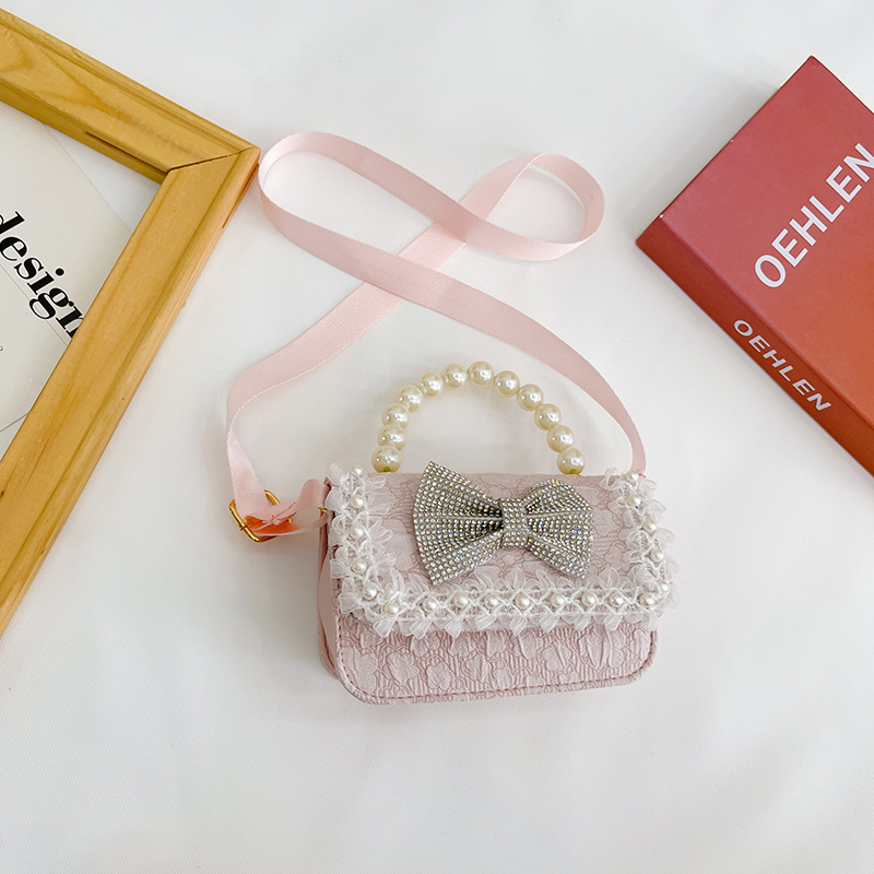 Bolsa de Niños de estilo coreano lindo arco perla Bolso pequeño princesa estilo occidental desgaste a juego joyería bolsa crossbody bolsa