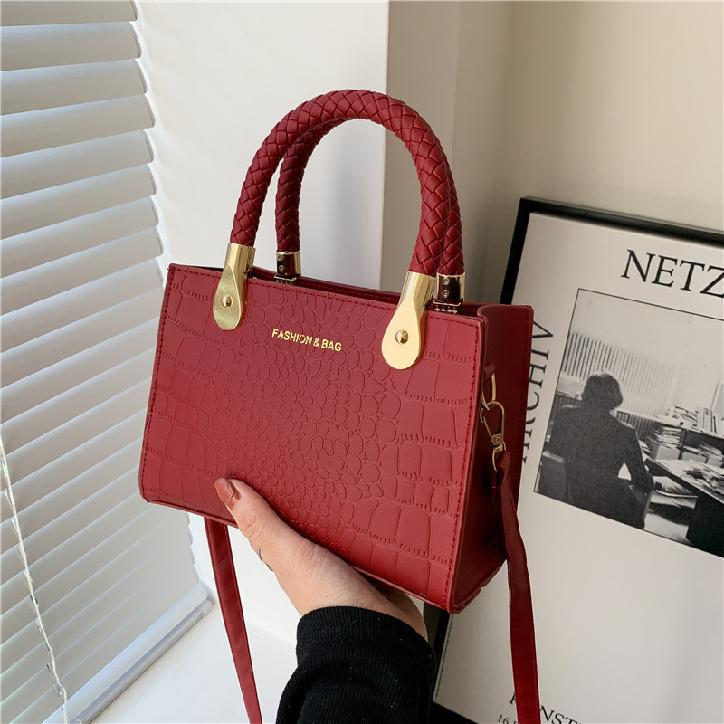Bolsa de moda con textura para mujer 2024 estilo coreano estilo occidental nuevo color caramelo patrón de piedra bolso tejido bolsa de mensajero