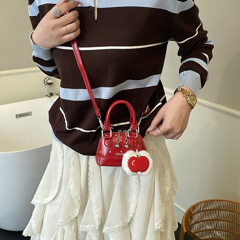 Bolsas coreanas para niños y niñas, bolsas de conchas, bolsas de mano de manzana, bolsas para niños, bolsas de comercio exterior transfronterizas 2026