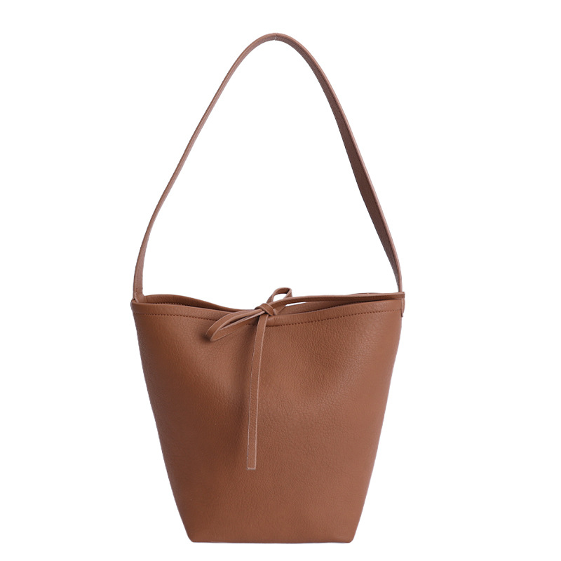 Bolsa de cubo de viaje coreano para mujeres 2025 nuevo estilo de alta calidad, bolso de hombro de cuero suave de gran capacidad, bolso de madre