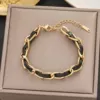 Black woven golden bracelet