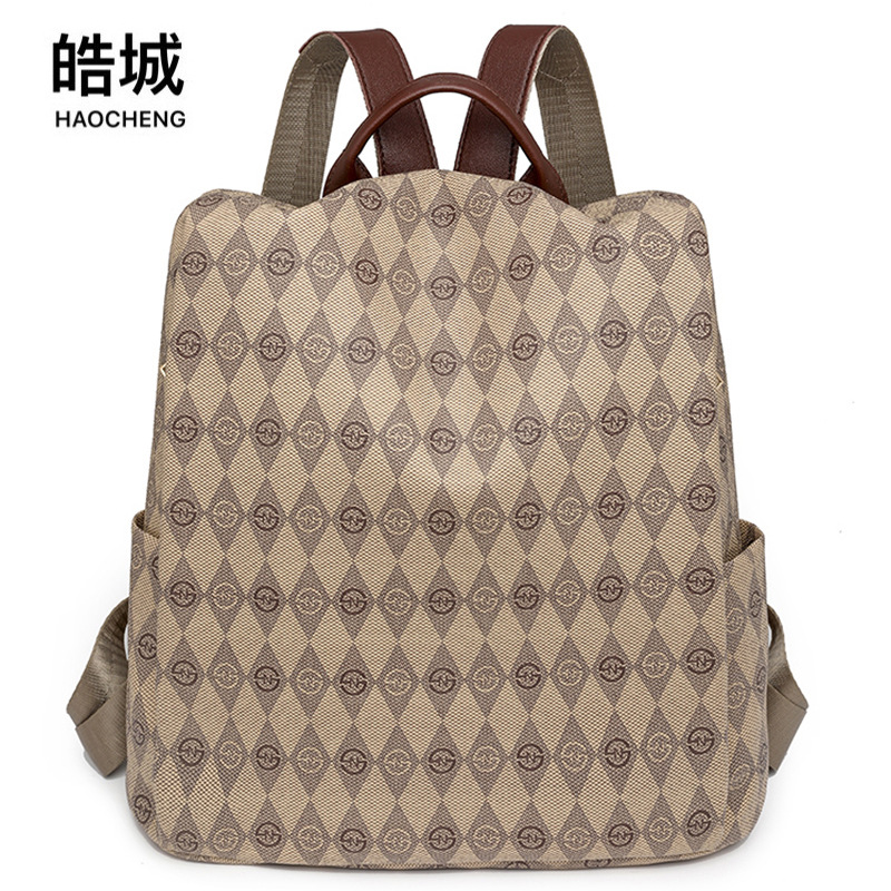 2024 nueva mochila con estampado de rombos para mujer, moda de moda, mochila de viaje antirrobo retro de gran capacidad