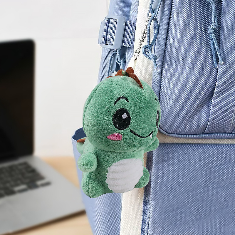 Lindo rubor pequeño sentado dinosaurio llavero de felpa bolso escolar colgante colgante máquina de garras muñeca muñeca regalo