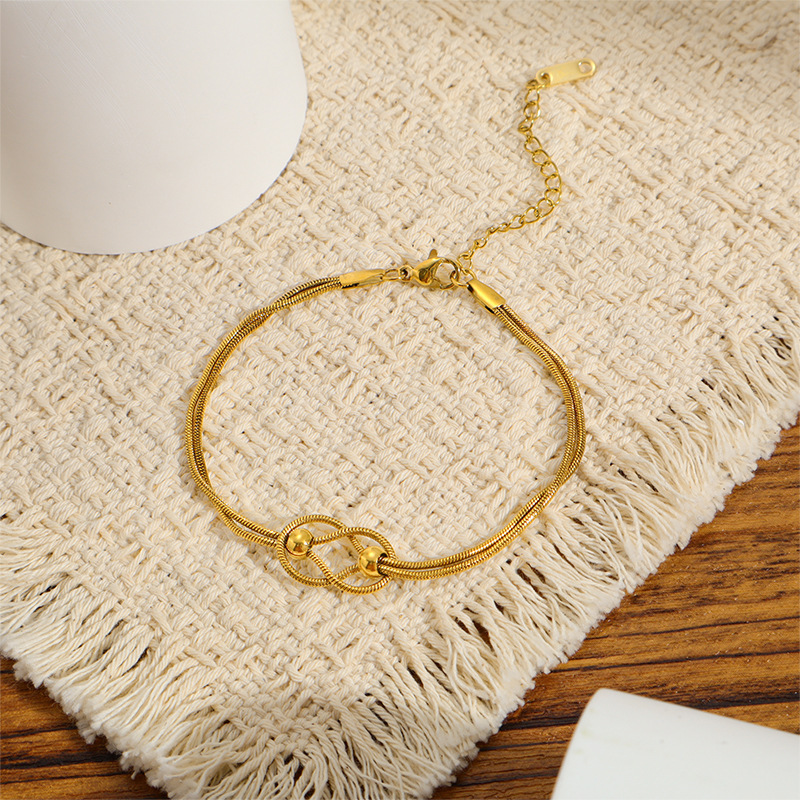 Titanium steel vacuum-plated 18k gold non-fading cross-border bestseller knotted small gold ball bracelet, exquisite light luxury style bracelet Titanium steel vacuum-plated 18k gold non-fading cross-border bestseller knotted small gold ball bracelet, exquisite light luxury style bracelet
