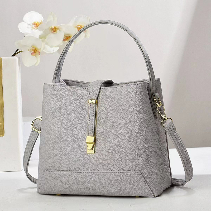 Fabricante bolsos de mujer 2025 nuevo bolsos de mano texturas coreanas de hombro de una sola forma de bolsos de cubo de mujer bolsos