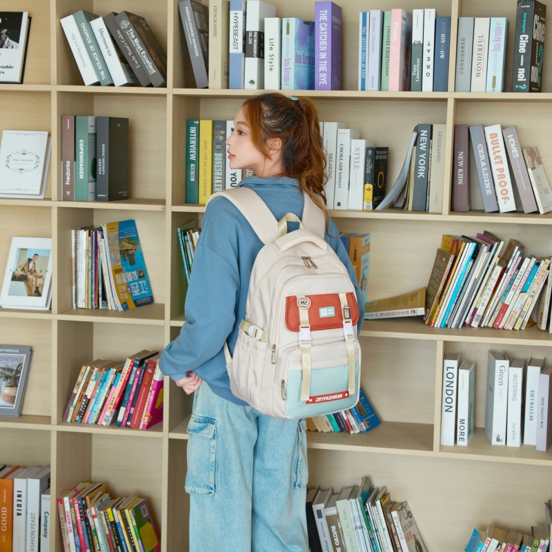 2025 pescado natural de alto valor de la cara mochila de alta capacidad multicapa de estudiantes de secundaria y secundaria simple y versátil