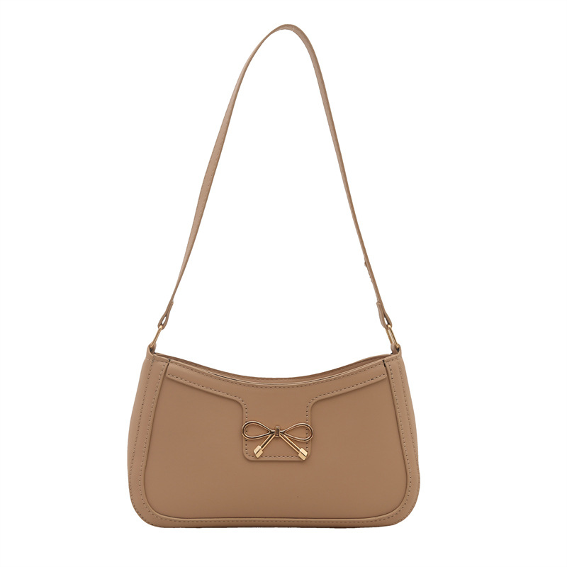 Bolso de hombro popular de este año con lazo para damas de gran capacidad 2025 color sólido nuevo bolso de axila simple de textura de moda