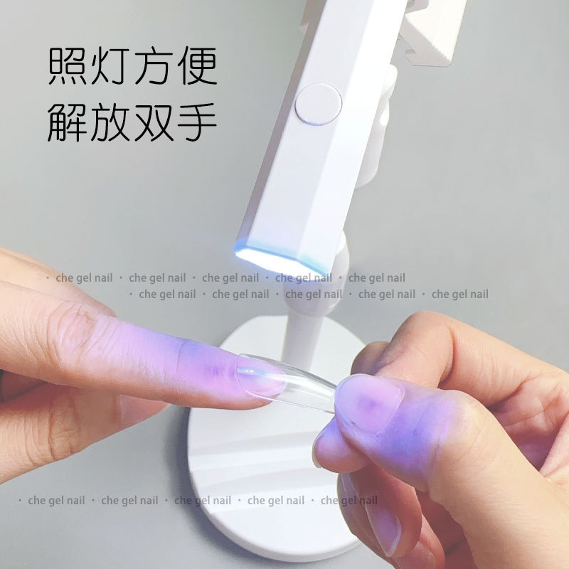 Lámpara de uñas de mano pequeña portátil recargable mini lámpara de fototerapia construcción rhinestone pluma de secado rápido lámpara hexagonal