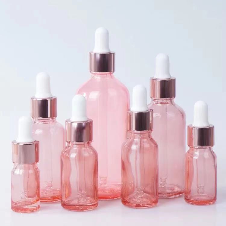 Venta al por mayor 10ml melocotón transparente vidrio Rosa botella de aceite esencial 20ml cosmética sub-botella Rosa anillo de oro botella de vidrio