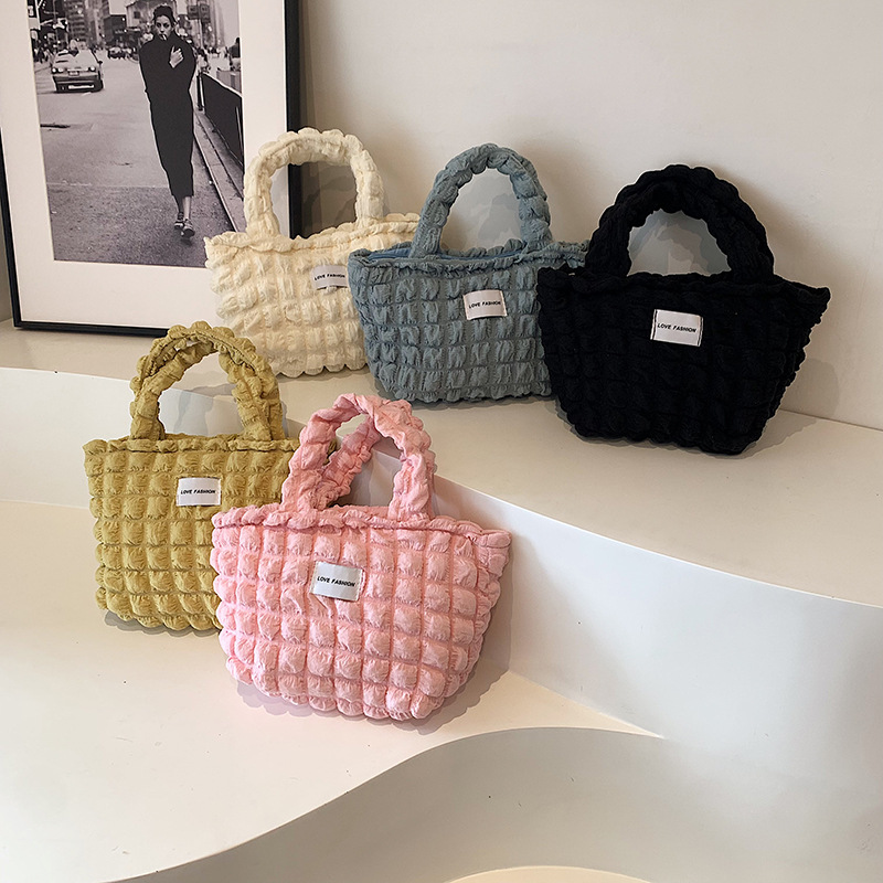 Versión coreana del nuevo bolso de hombro de color caramelo de corazón de niña pliegue de burbuja de nube simple bolso de gran capacidad mujer