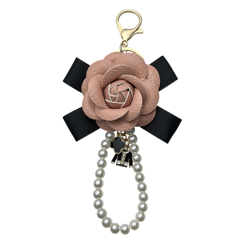 Arco pu Camelia llavero bolsa colgante perla cadena moda exquisita transfronteriza llavero Yiwu fabricante