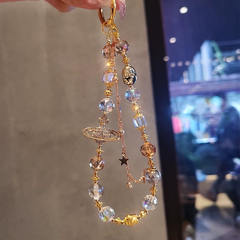 Cadenas de alta sensación de cuentas de cristal de Saturno parpadeante nuevo estilo chino bolso de cámara colgante corta cuerda de caso de teléfono móvil