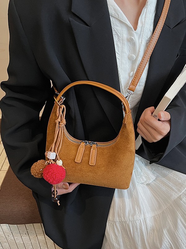 2025 nueva textura bolsas de brazo mujeres otoño de alto nivel bolsas de mano de nicho bolsas de mano coreanas bolsas de饺os versátiles
