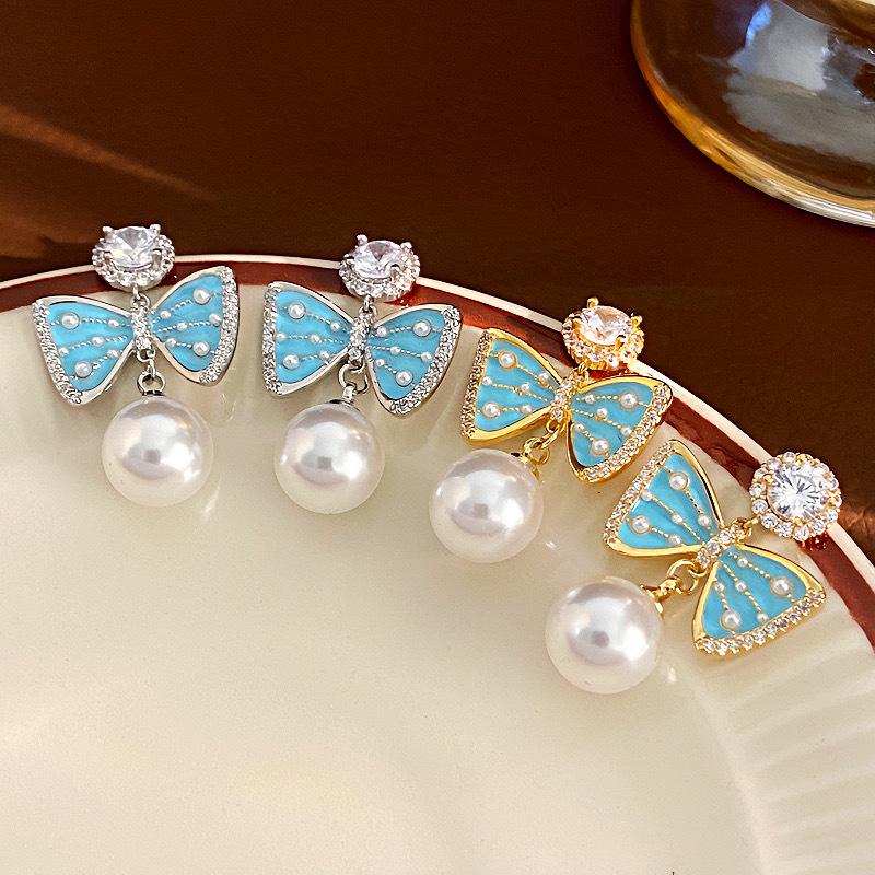 Retro earrings with bow with zircon pearl