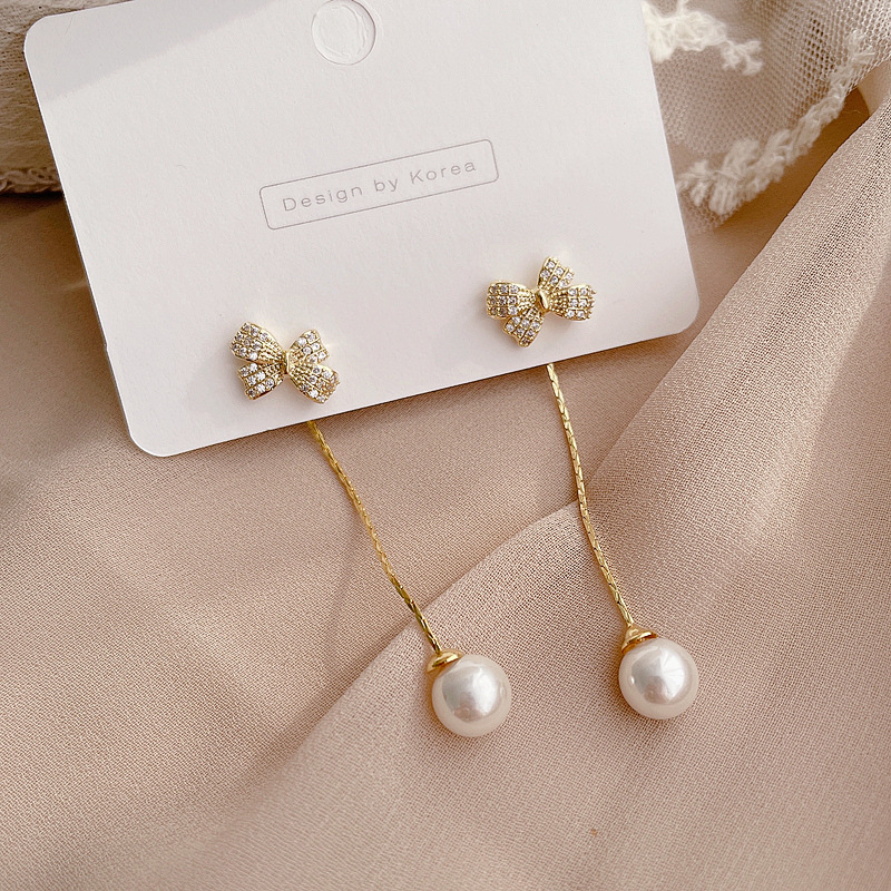 Korean New Simple Pearl Bowknot Earrings display picture 1