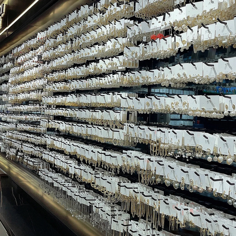 Pendientes de suministro empresarial de puestos de mercado nocturno pendientes al por mayor transfronterizos Pendientes de borla de temperamento de todo fósforo popular Pendientes coreanos