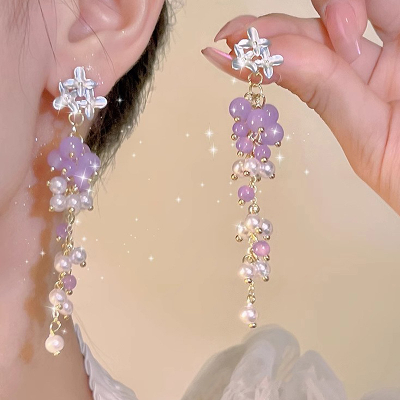 Diseño de nicho de alta gama borla larga sin orejas clip de oreja elegante estilo occidental de las mujeres cara-mirando pequeños nuevos pendientes de moda