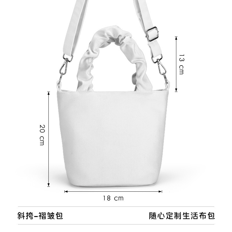 斜めに掛けてしわのバケツを包んで注文して文創美術の挿絵のブランドのお土産の展示会の活動の共同購入の布の包みを作ります。|undefined