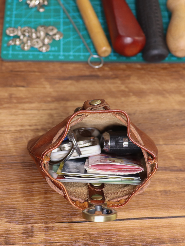 日本のシンプルなトップ層の牛革はなめし革のレトロな女性の香りのカバンのミニのキーホルダーのカードのカバンの小銭入れの収納袋を植えます。