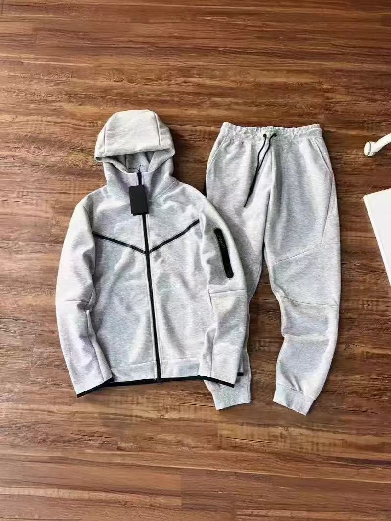 Camiseta con cremallera encapuchada transfronteriza para hombres primavera y otoño nueva chaqueta casual de ropa deportiva, pantalones de pies pequeños, dos piezas