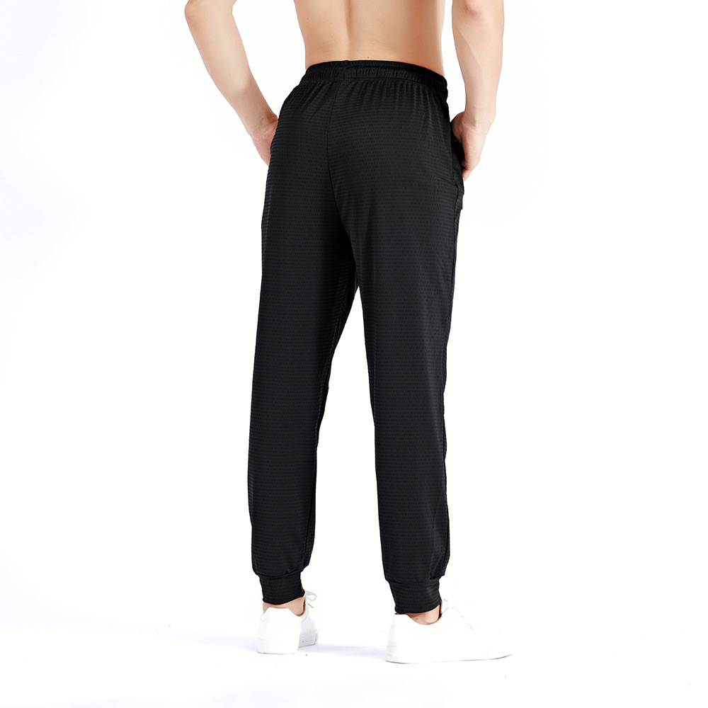 Pantalones deportivos de otoño sueltos más el tamaño de los hombres pantalones elásticos de entrenamiento de secado rápido pantalones ajustados de seda de hielo transpirable en stock