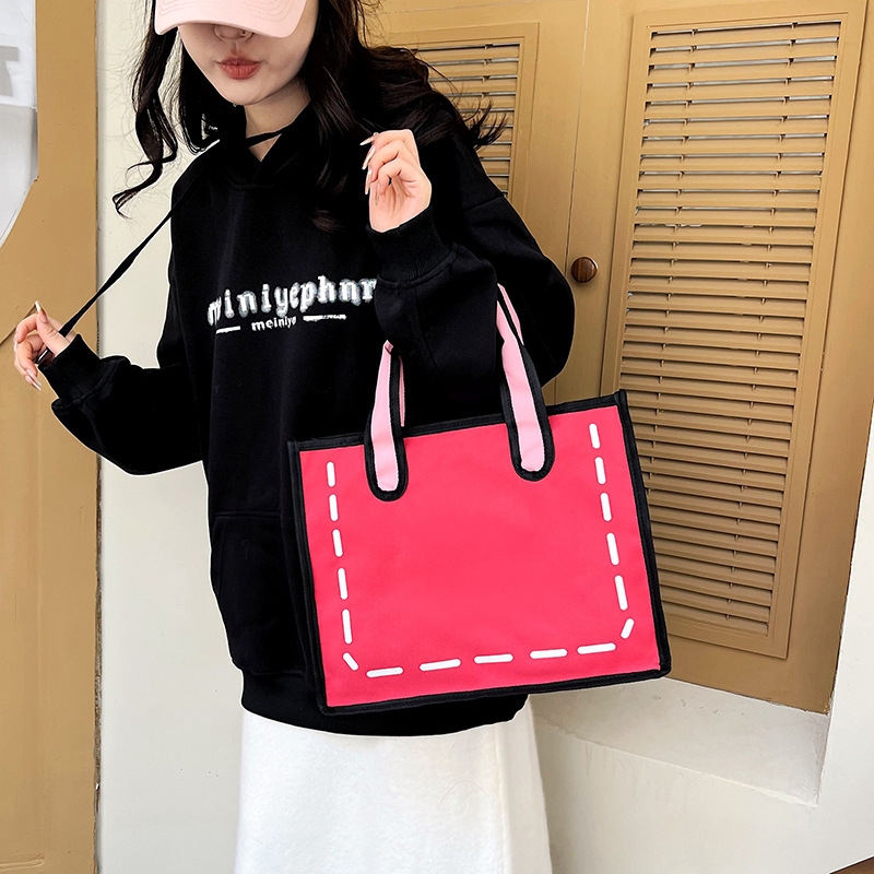 2023 nuevo bolso de lona de niña japonesa de dibujos animados bidimensional para mujer bolso de compras portátil a juego de color bolso de hombro de gran capacidad