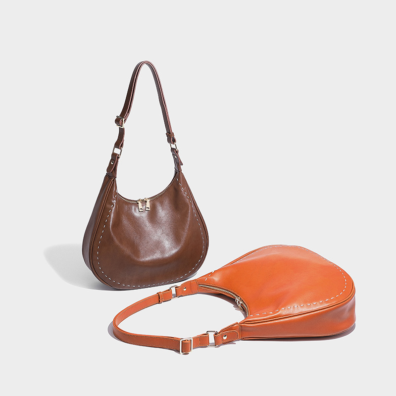 2024 Nova bolsa de ombro da moda com sentido avançado, versatilidade casual, estilo crossbody, elegância, bolsa feminina portátil_voghion.com