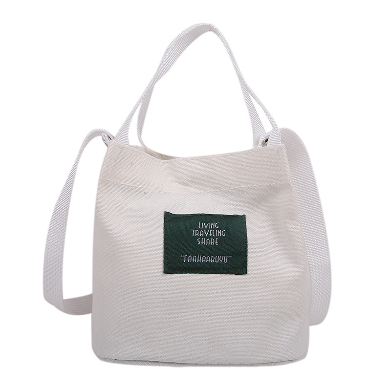 Bolso de mujer nuevo estilo coreano simple bolso de lienzo de chicas fresco de color sólido bolso de cubo de moda moda bolsa de mochila casual