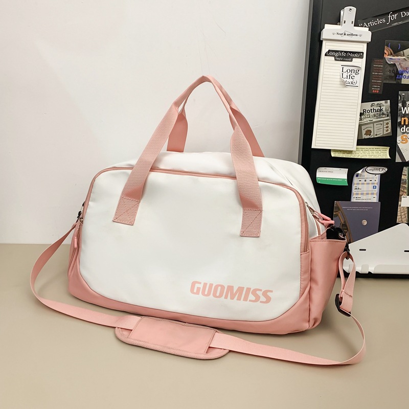 Nueva bolsa de viaje corto simple de gran capacidad de viento para hombres y mujeres bolsa de ocio deportiva bolsa de ejercicio bolsa de mochila