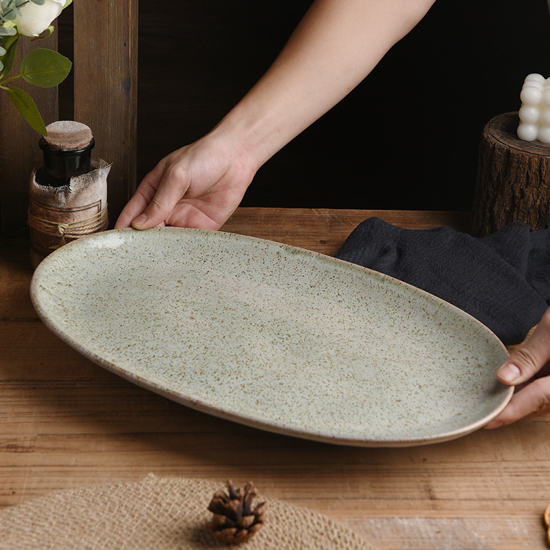 Transfronterizos exclusivos para cubiertos de hotel retrógrados grandes platos de cerámica de alto valor familiar platos de pescado al vapor elípticos