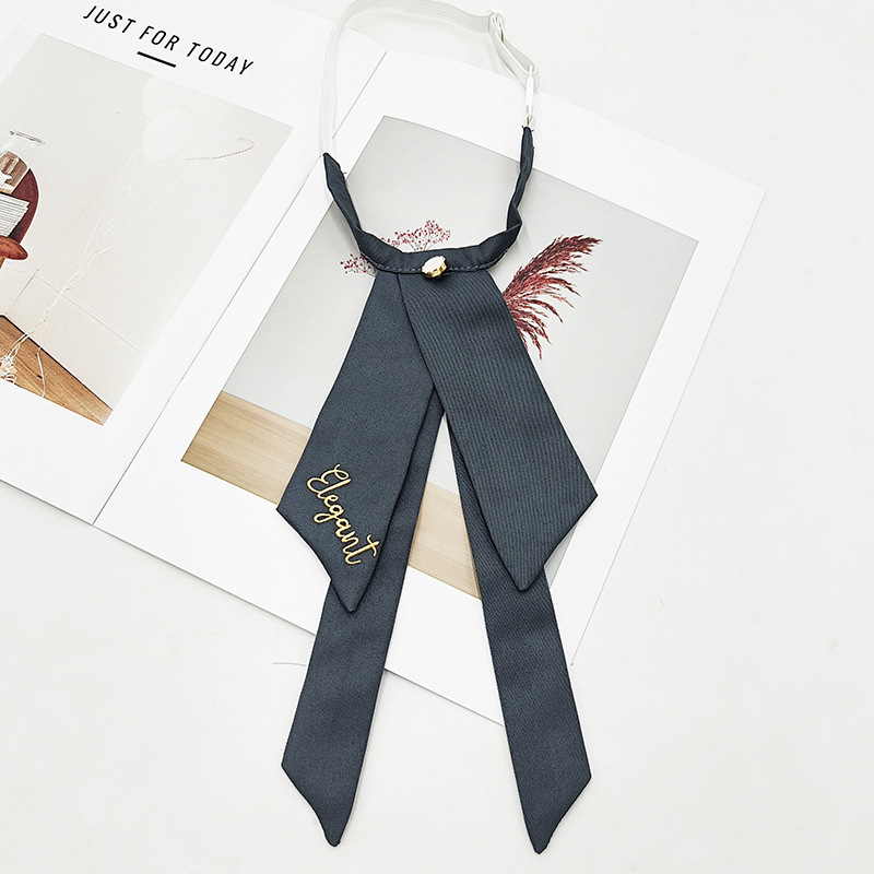 Fabricante spot color sólido jk pajarita versión coreana femenina estilo universitario arco foto de graduación traje de soltero bordado cuello flor serpentina