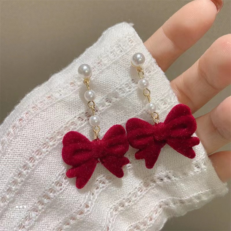Demi-season burgundy retro earrings with bow from pearl