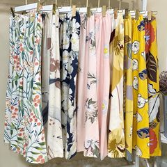 綿のシルクの夏の新型のゆったりした大きいサイズの海辺の広い足のズボンの女性は純綿の人工綿のズボンを着ることができます。