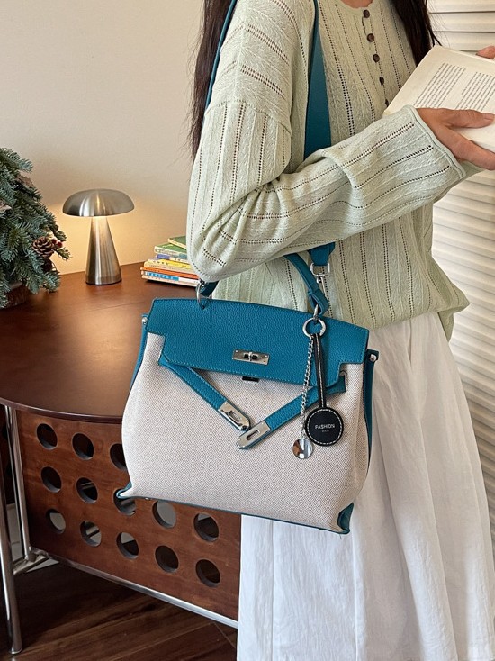 Bolso para mujeres 2026 nuevo cross-border lienzo empalme color contraste bolso de mano alta sensación retro mochila de hombro
