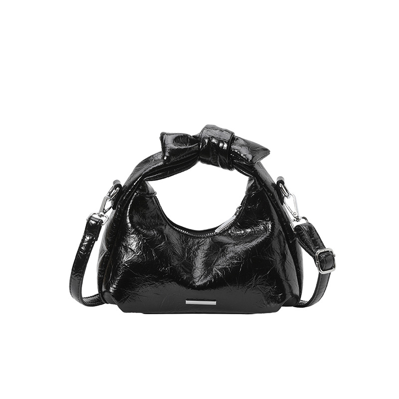 Bolsa de mano de arco para mujeres 2026 nuevo bolso de hombro de moda de verano super caliente sensación diaria mochila de viaje