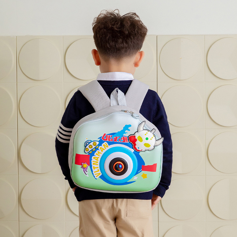Jardín de infantes 2025 lindos dibujos animados mochila de cámara estereoscópica para bebés masculinos y femeninos mochila pequeña bolsa de bocadillos para niños