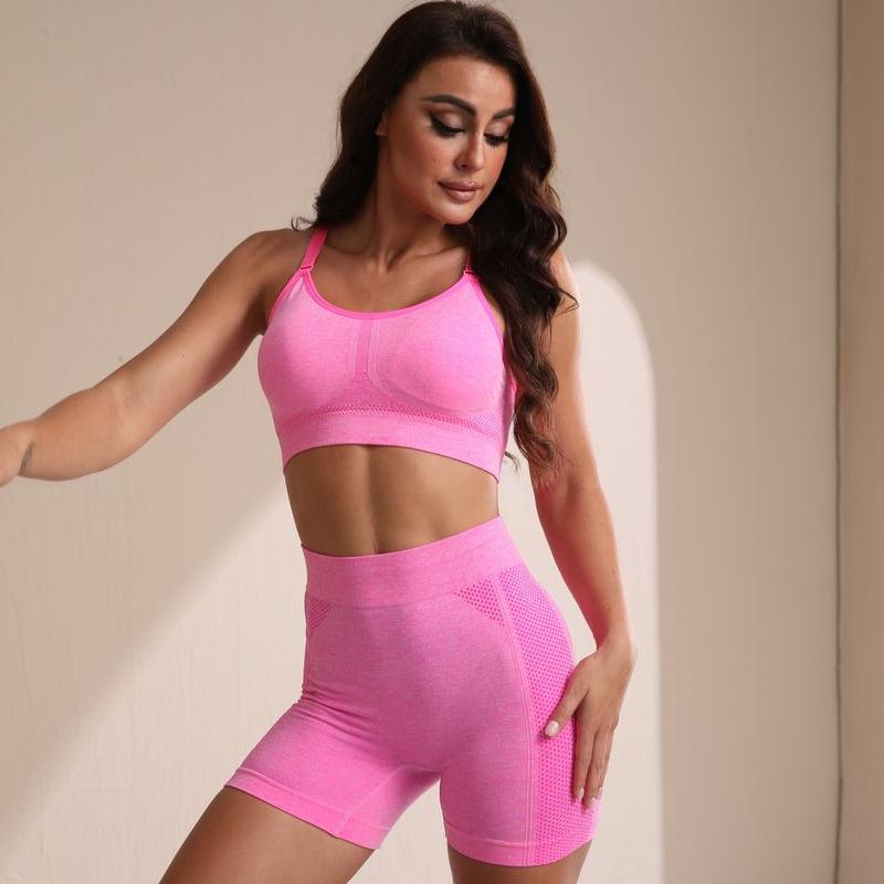 Nuevo traje de yoga sin costuras transfronterizo de color sólido en forma de trabajo diseño hueco sexy moda traje deportivo pantalones cortos