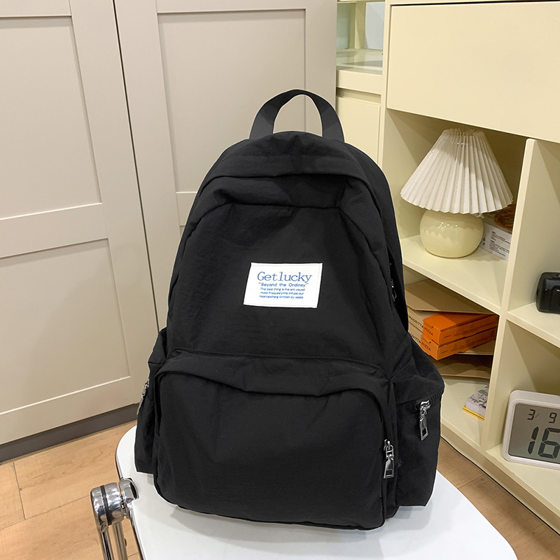 2025 nueva mochila para estudiantes universitarios japoneses, mochila escolar ligera, mochila de viaje simple, impermeable y de gran capacidad