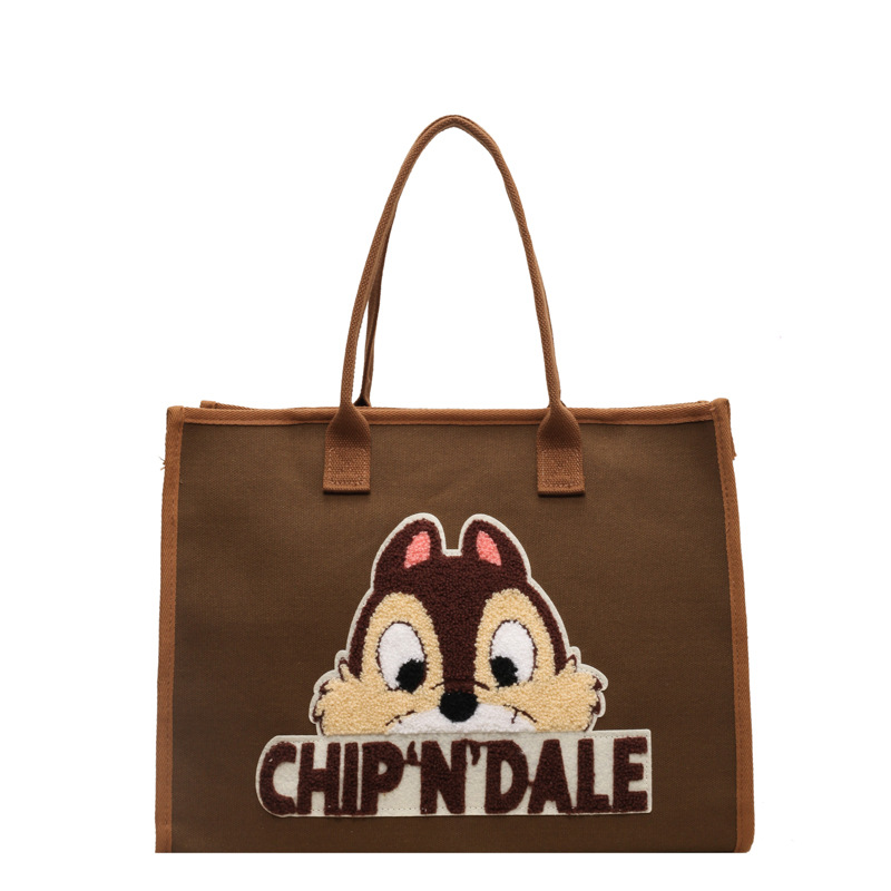 Bolsa de lona de gran capacidad para mujeres 2025 nuevo estilo urbano minimalista de moda de dibujos animados portátil de hombro para viajar bolsa