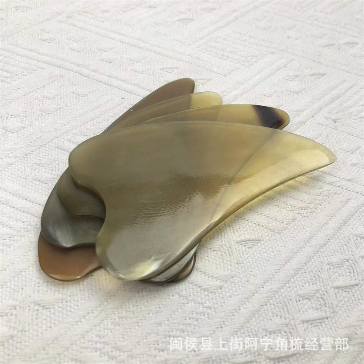 Heart Shaped Buffalo Horn Gua Sha Scraping Board 10-11cm for Back Neck Body Care in use