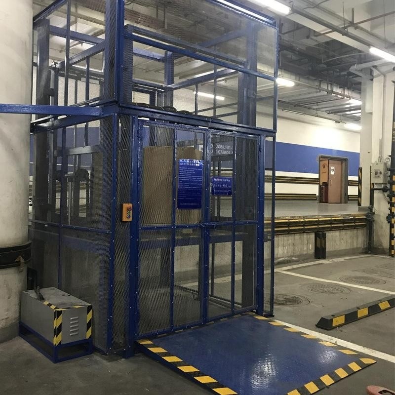 Plataforma elevadora fija de transporte de carga sobre rieles, elevador de carga hidráulico eléctrico para almacén, móvil para carga y descarga