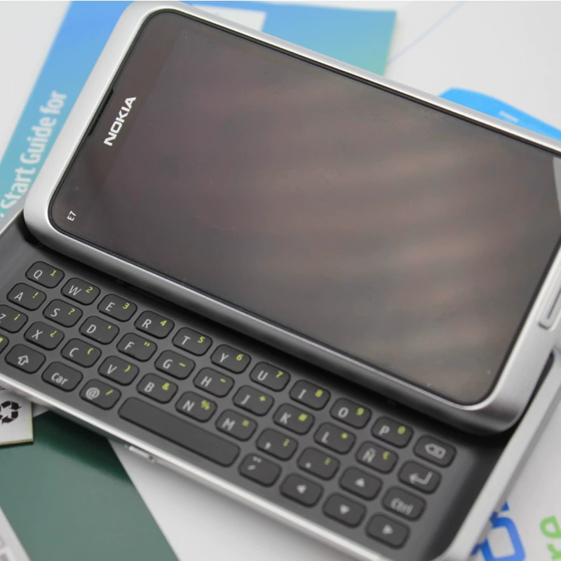 Классический рекомендуемый E7-00 инвентарь мобильного телефона с полной клавиатурой дизайн боковой слайд для традиционной внешней торговли телефона