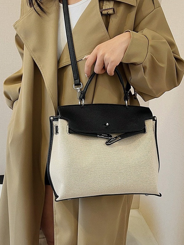 Bolsa de mano transfronteriza para mujeres 2026 nueva tela de lino empalmada color de textura de viaje mochila de hombro