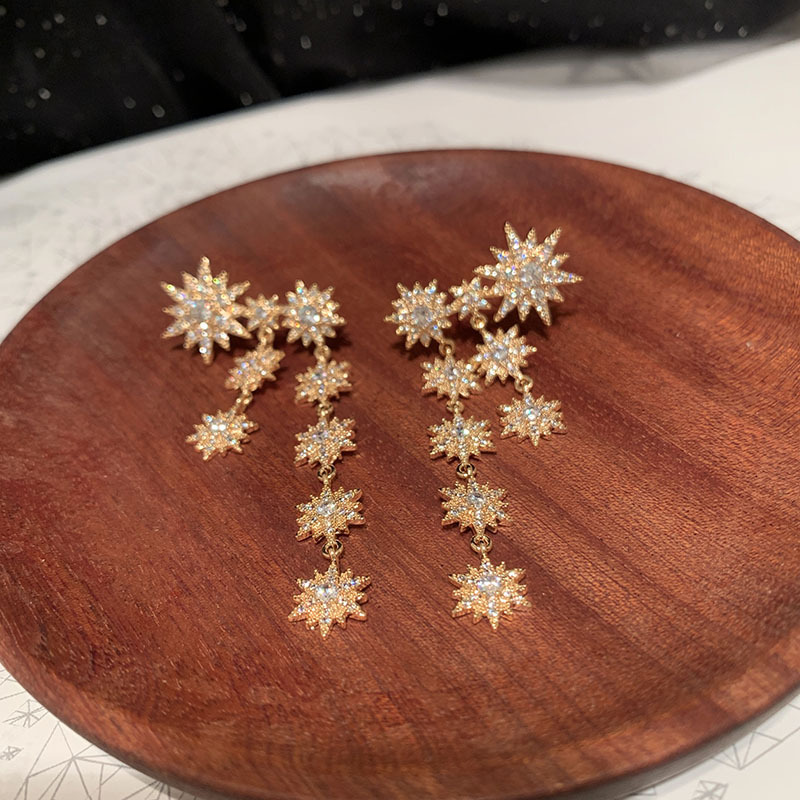 Fashion Eight-pointed Star Long Tassel Inlaid Zircon Copper Snowflake Earrings display picture 3