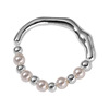 Round beads from pearl, ring, silver 925 sample, simple and elegant design, on index finger